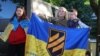Imagine din cadrul unei manifestări de comemorare a membrilor batalionului Azov căzuți pe câmpul de luptă și a celor aflați în captivitate, ce a avut loc în Zaporijia, în Ucraina, pe 5 mai.