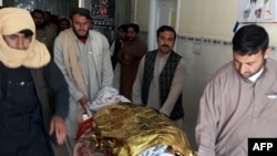 Pakistani relatives push a stretcher carrying the body of a victim at a hospital following cross border clashes between Afghan and Pakistani forces on May 5.
