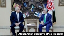 U.S. Special Representative for Afghanistan Zalmay Khalilzad (left) met with Afghan Chief Executive Abdullah Abdullah in Kabul on September 2.