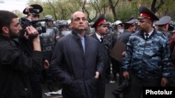 Armenia - Nerses Nazarian (C), chief of the Yerevan police, oversees riot police forces clashing with opposition protesters in Yerevan, 9Apr2013.