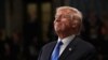 U.S. -- U.S. President Donald Trump smiles during the State of the Union address in the chamber of the U.S. House of Representatives in Washington, January 30, 2018