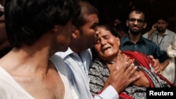 Pakistan -- A Christian woman mourns the death of her son at the site of a suicide blast at a church in Peshawar, September 22, 2013. 