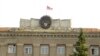 Nagorno-Karabakh - The Karabakh flag flies over the main government building in Stepanakert, 9Jul2011.